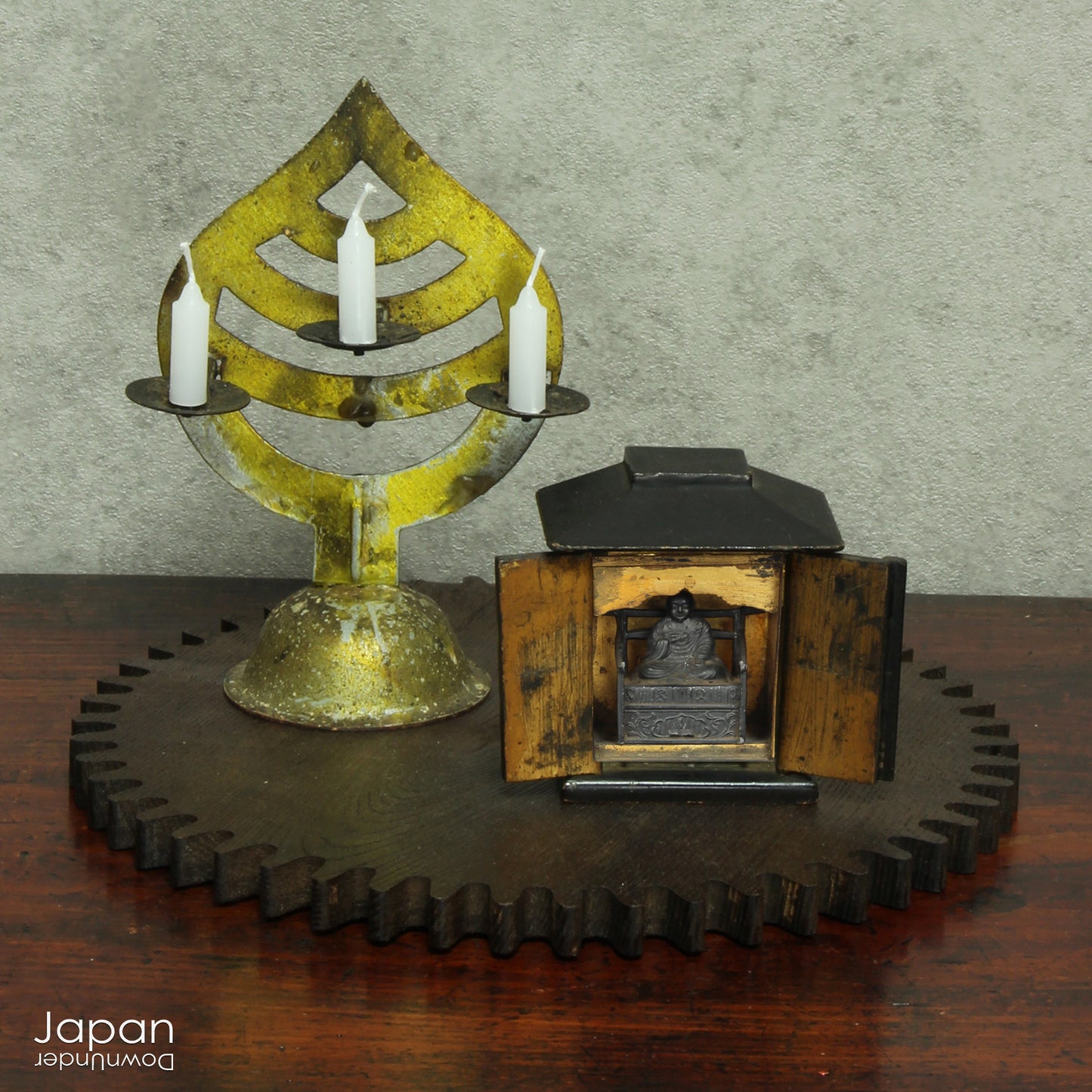 Create a touch of rare elegance in your space with this wonderful miniature antique lacquer Buddhist shrine. Housing the revered monk Kukai, this finely detailed piece also comes with a small candle holder for a serene ambiance.