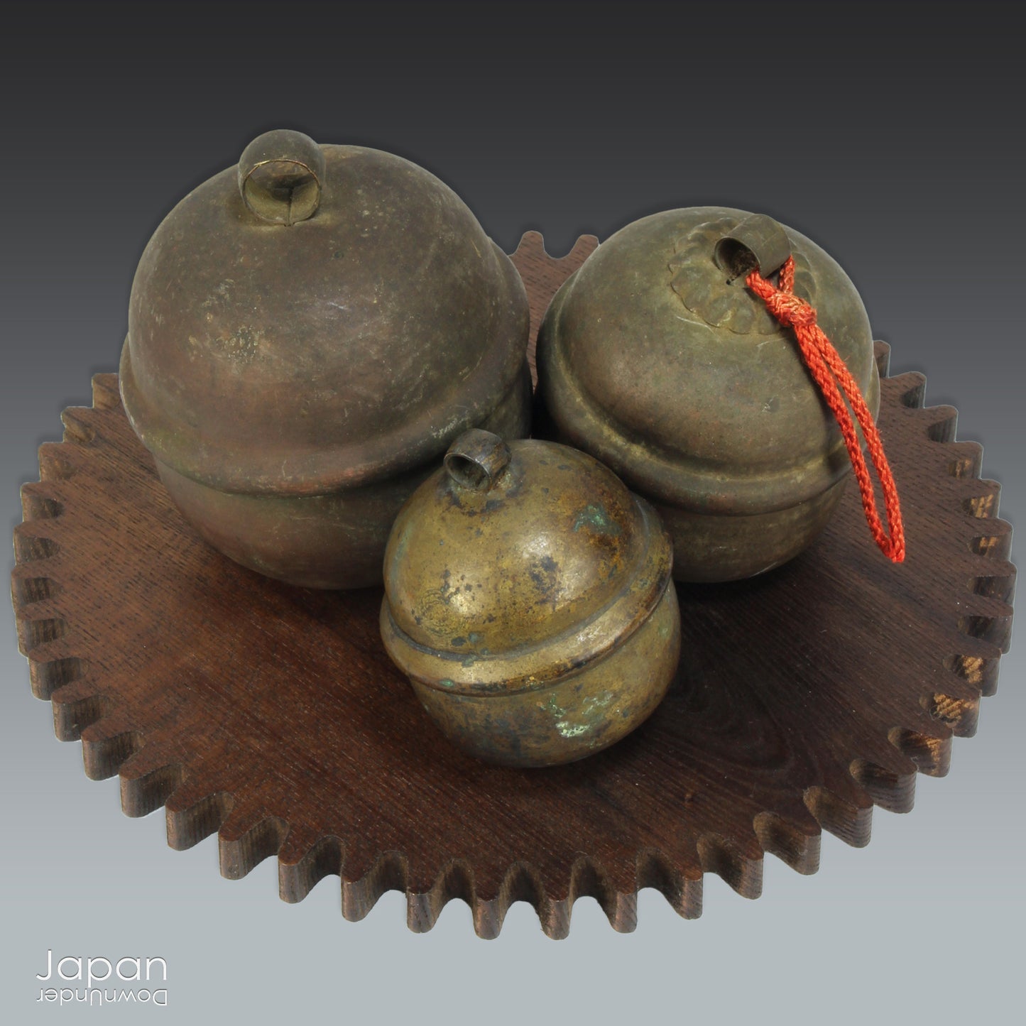 Bring a touch of timeless tradition into your home with this exquisite set of three antique Shinto bronze bell lucky charms, or omamori. Each bell boasts a beautiful, rich patina that speaks of its age and history, adding a unique, vintage charm to any space. These bells aren't just decorative; they are imbued with centuries of spiritual significance, believed to offer blessings, protection, and good fortune to those who possess them.