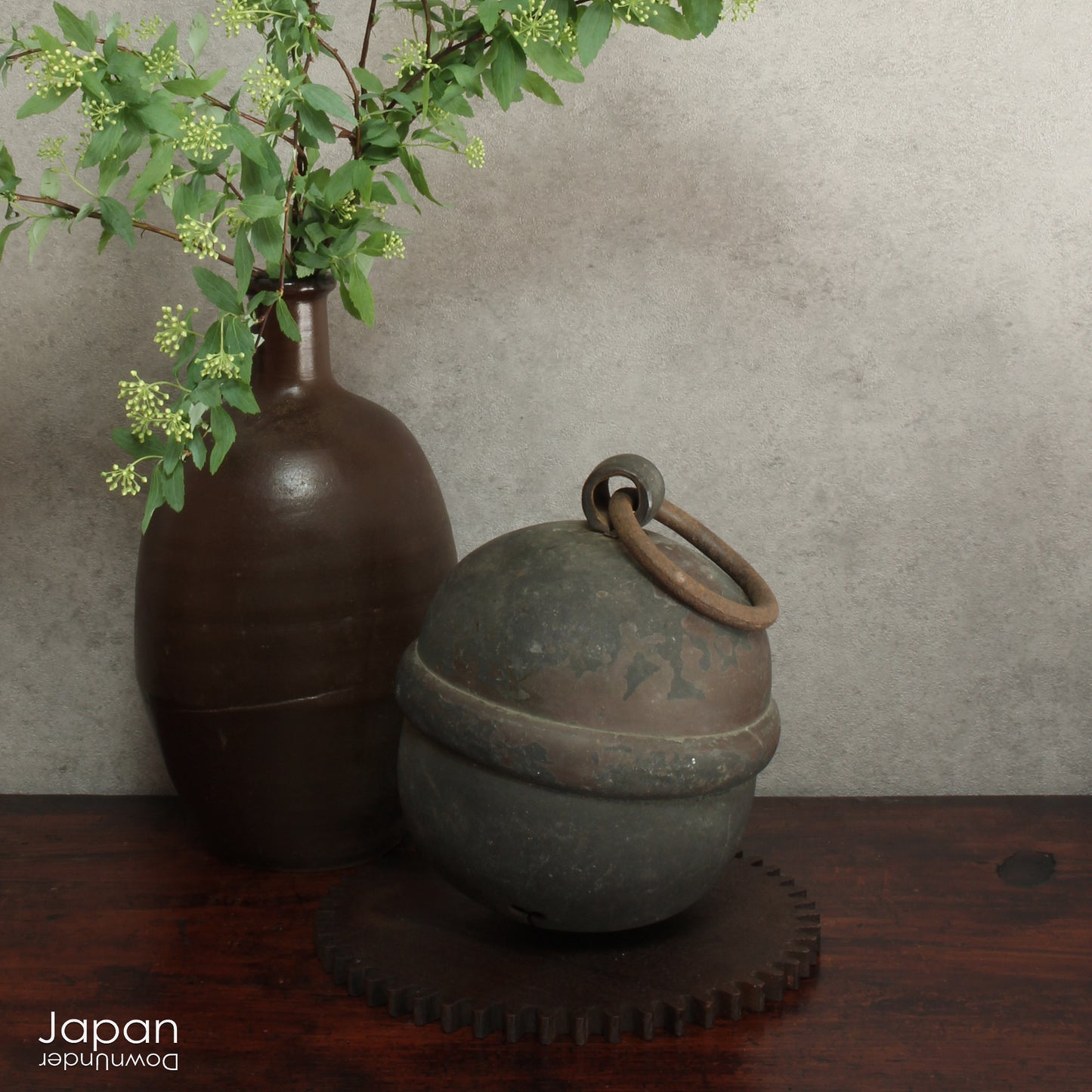 This bell, once used in the sacred rituals at Shinto shrines, was traditionally rung before prayer to call the attention of the enshrined Kami (spirits or gods). The sound not only symbolizes an invitation to the divine but also purifies the worshiper, warding off evil and inviting blessings into the space. The ringing of the bell before prayer is a moment of reflection, a tradition passed down through generations.