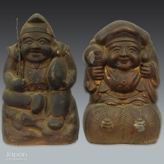 Add a touch of Japanese charm to your home with these quaint antique metal money boxes in the shape of the lucky gods Ebisu and Daikoku. Perfect for bringing a unique cultural vibe to your home decor or as a thoughtful gift for collectors. A wonderful decorative accent for lovers of antique treasures.