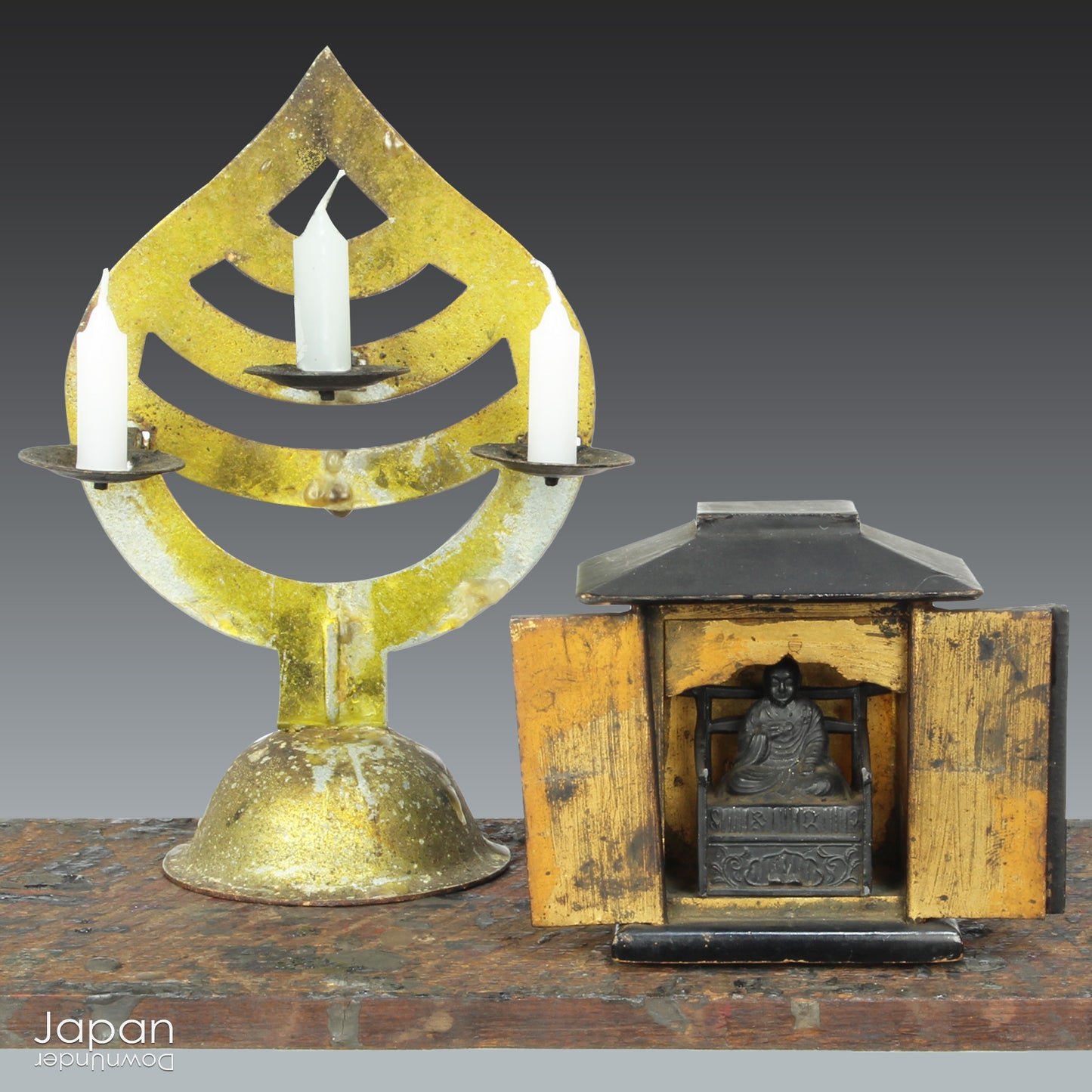 Create a touch of rare elegance in your space with this wonderful miniature antique lacquer Buddhist shrine. Housing the revered monk Kukai, this finely detailed piece also comes with a small candle holder for a serene ambiance.