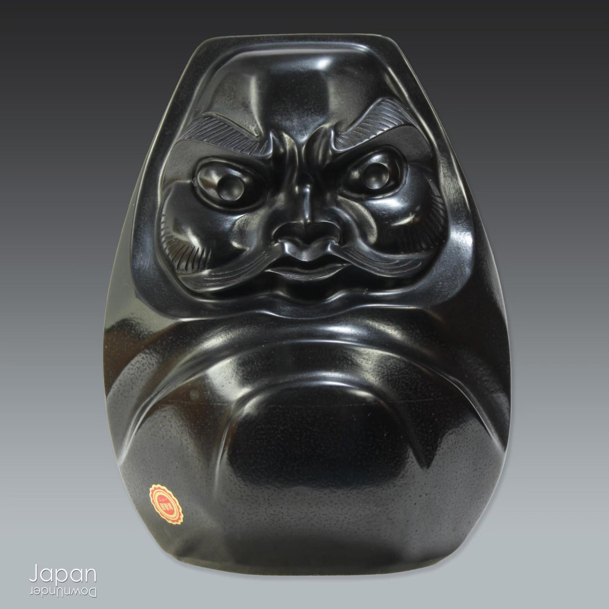 A vintage daruma statue crafted from Nachiguro slate, the same precious material used for Japanese Go game stones. A perfect blend of tradition and style for any collector or avid admirer of Japanese craftsmanship, seeking a unique decor accent.