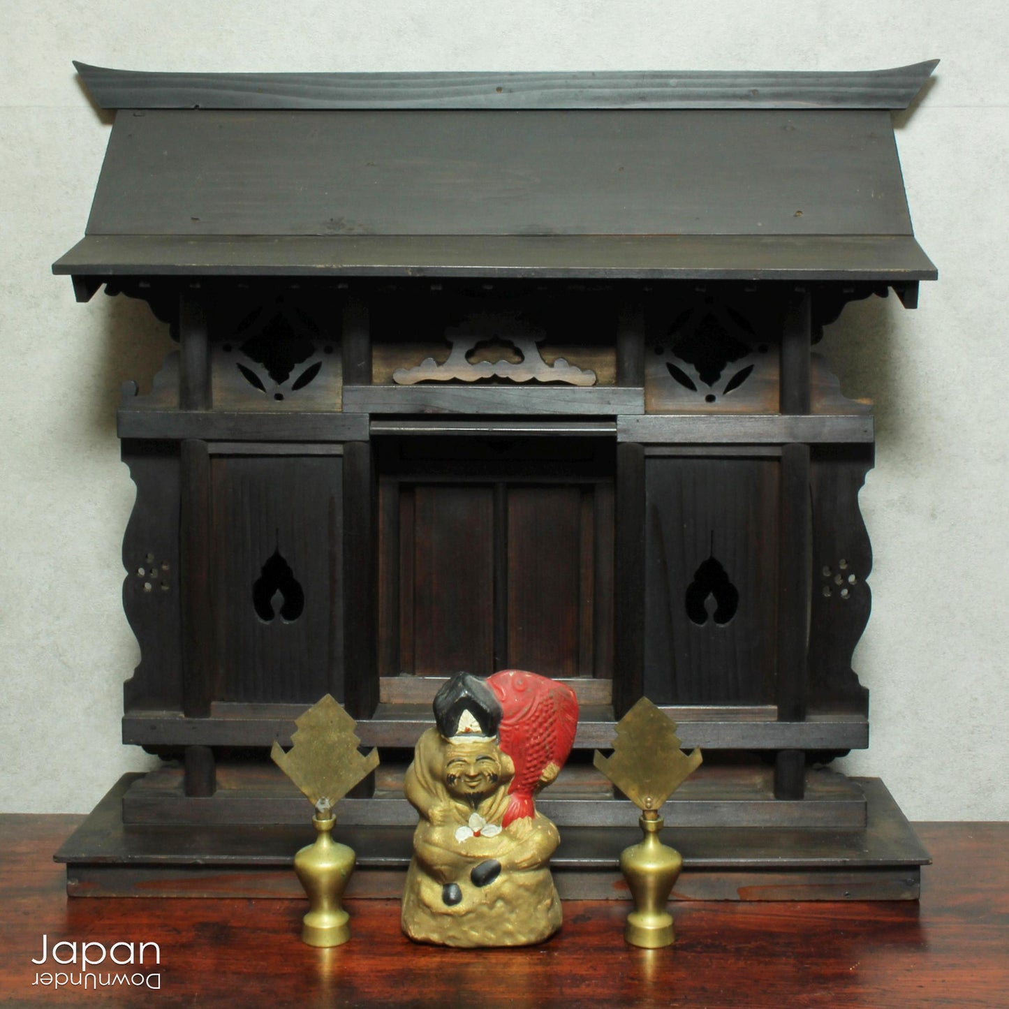 A wonderful antique folk art Japanese kamidana shrine that exudes a beautiful rustic charm, sure to add a touch of serenity to your living space. Crafted with intricate details and a timeless aesthetic.