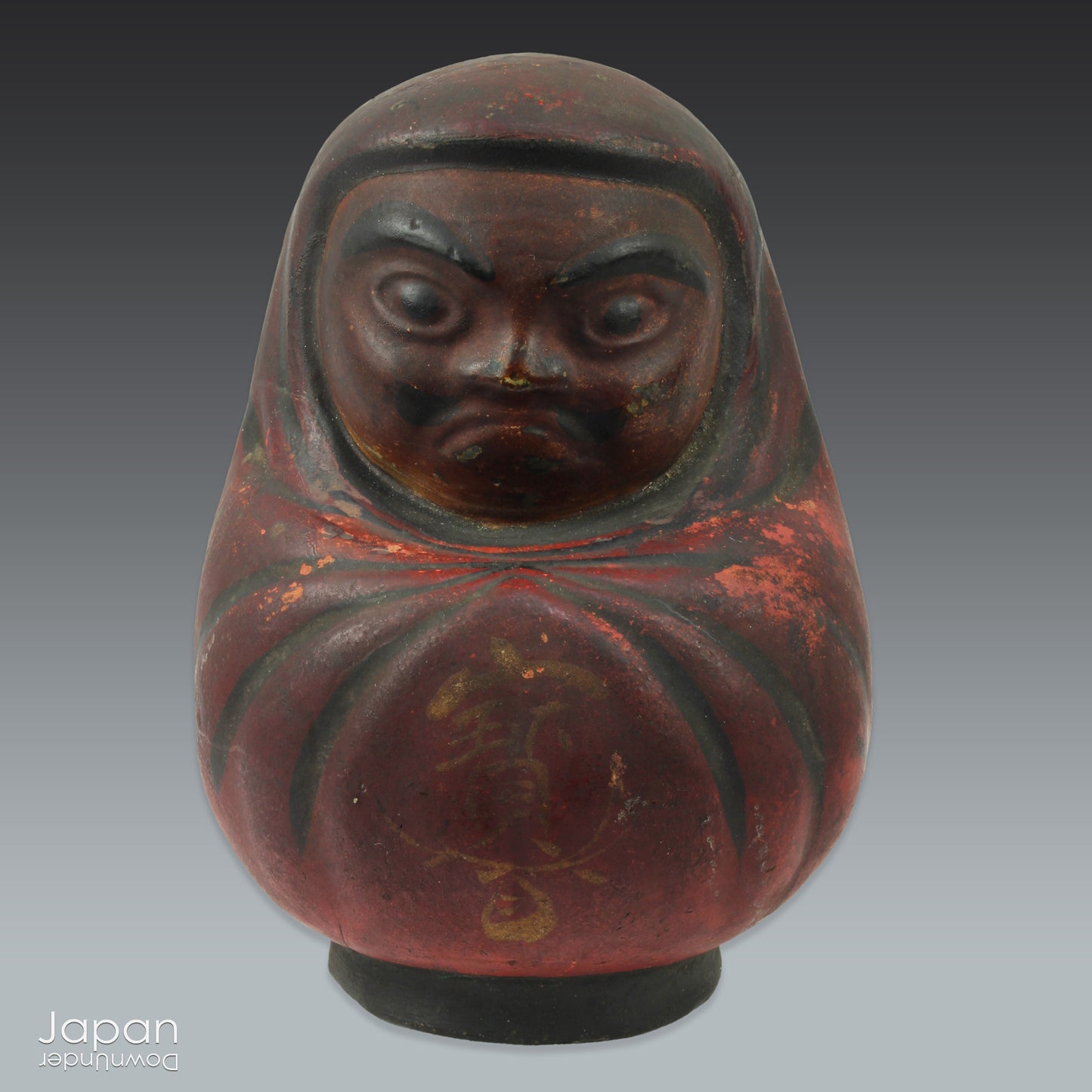 Add a touch of history to your home with this antique Meiji Era Hirashimizu ware lucky Daruma clay doll. Covered in soot it boasts a great darkened rustic patina that adds unique charm to any space. Bring a piece of the past into your modern decor.