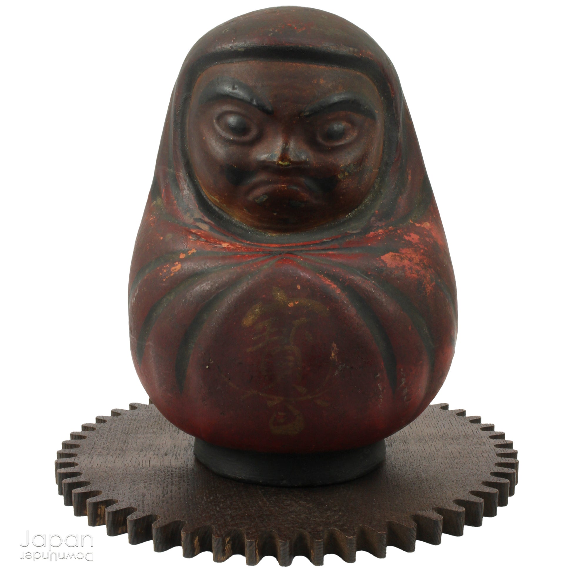 Add a touch of history to your home with this antique Meiji Era Hirashimizu ware lucky Daruma clay doll. Covered in soot it boasts a great darkened rustic patina that adds unique charm to any space. Bring a piece of the past into your modern decor.