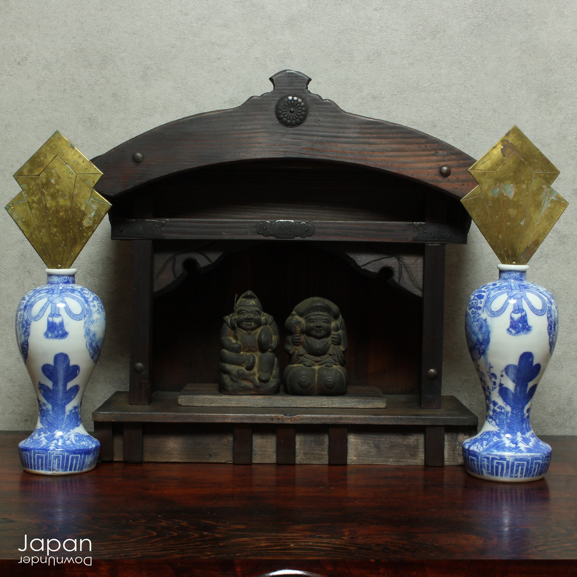 Enhance your sacred space with this wonderful pair of antique brass flames in old imari sake bottles, made to be offered at Shinto altars. Believed to attract prosperity and ward off evil, these unique pieces will bring a touch of tradition.