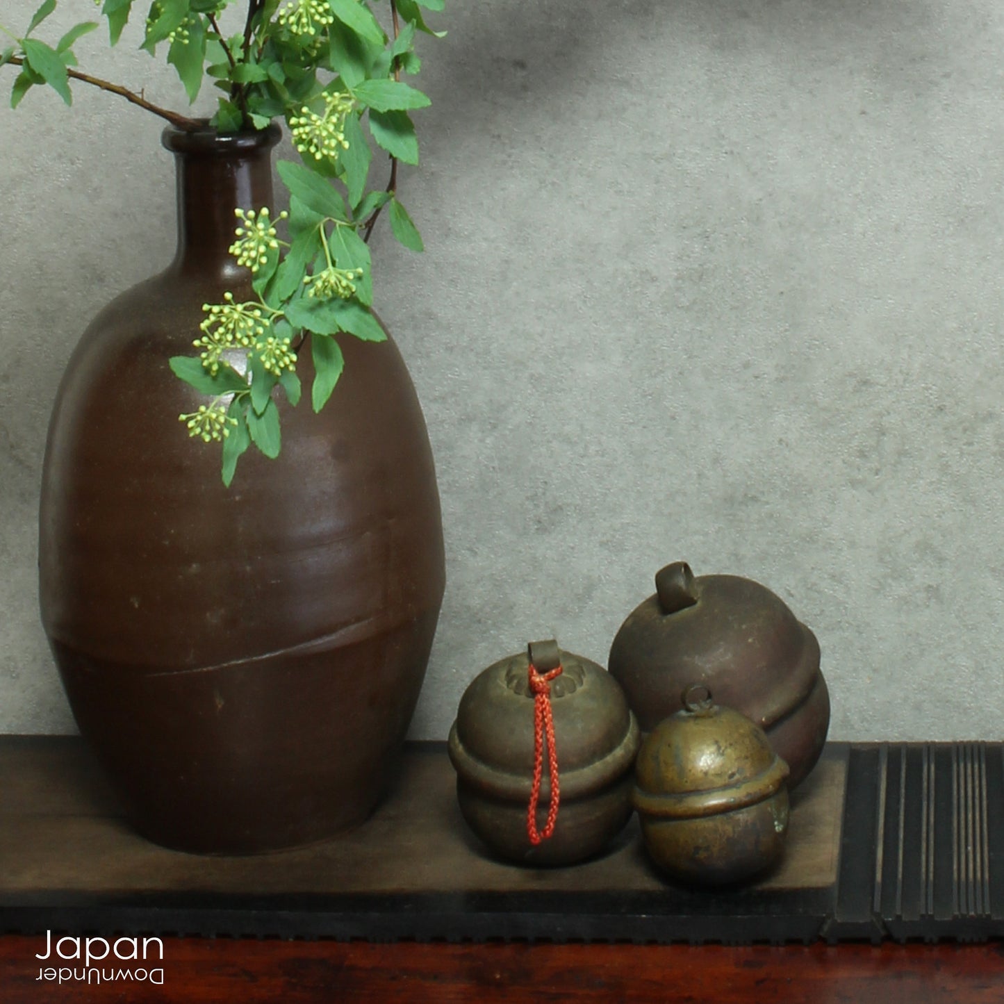 Bring a touch of timeless tradition into your home with this exquisite set of three antique Shinto bronze bell lucky charms, or omamori. Each bell boasts a beautiful, rich patina that speaks of its age and history, adding a unique, vintage charm to any space. These bells aren't just decorative; they are imbued with centuries of spiritual significance, believed to offer blessings, protection, and good fortune to those who possess them.