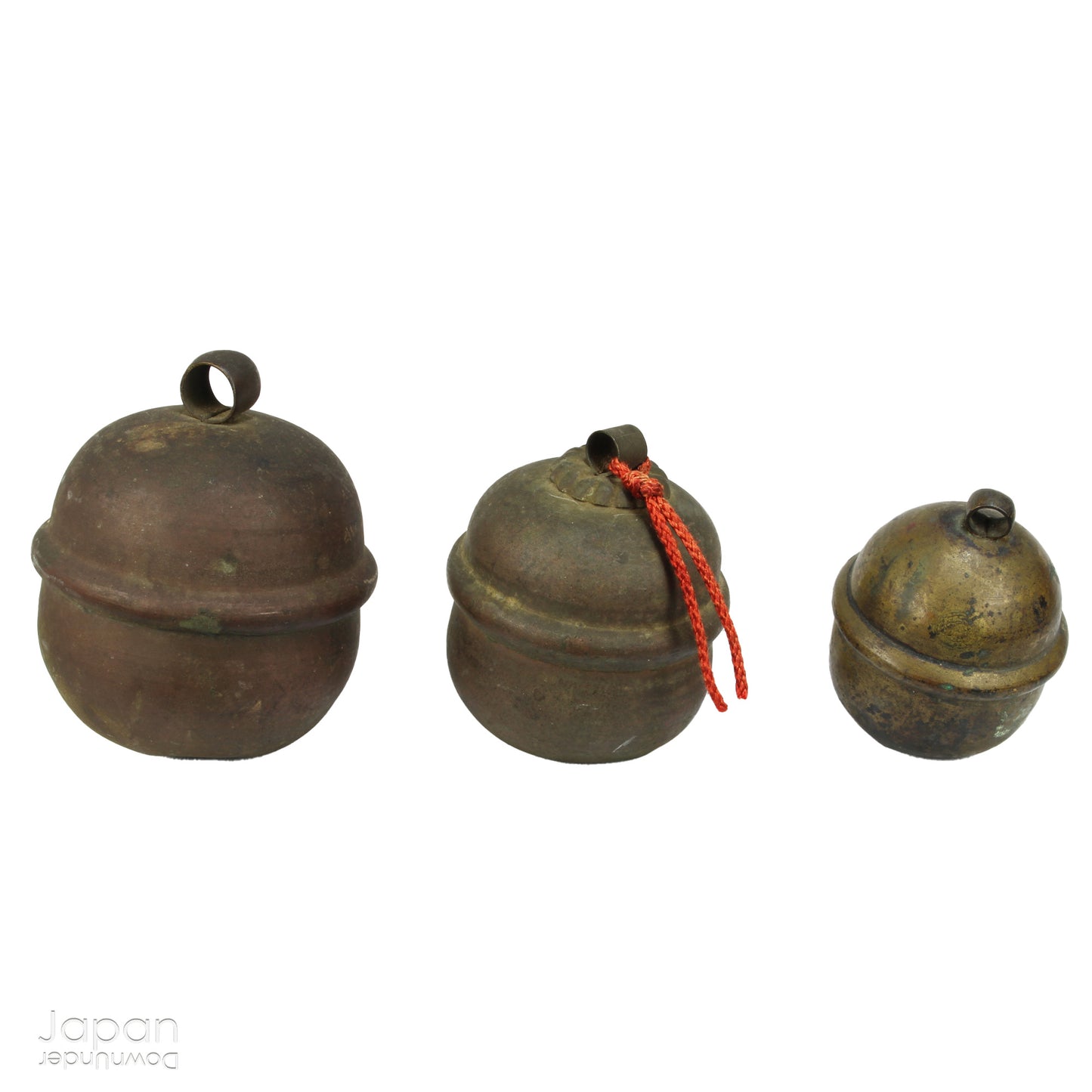 Bring a touch of timeless tradition into your home with this exquisite set of three antique Shinto bronze bell lucky charms, or omamori. Each bell boasts a beautiful, rich patina that speaks of its age and history, adding a unique, vintage charm to any space. These bells aren't just decorative; they are imbued with centuries of spiritual significance, believed to offer blessings, protection, and good fortune to those who possess them.