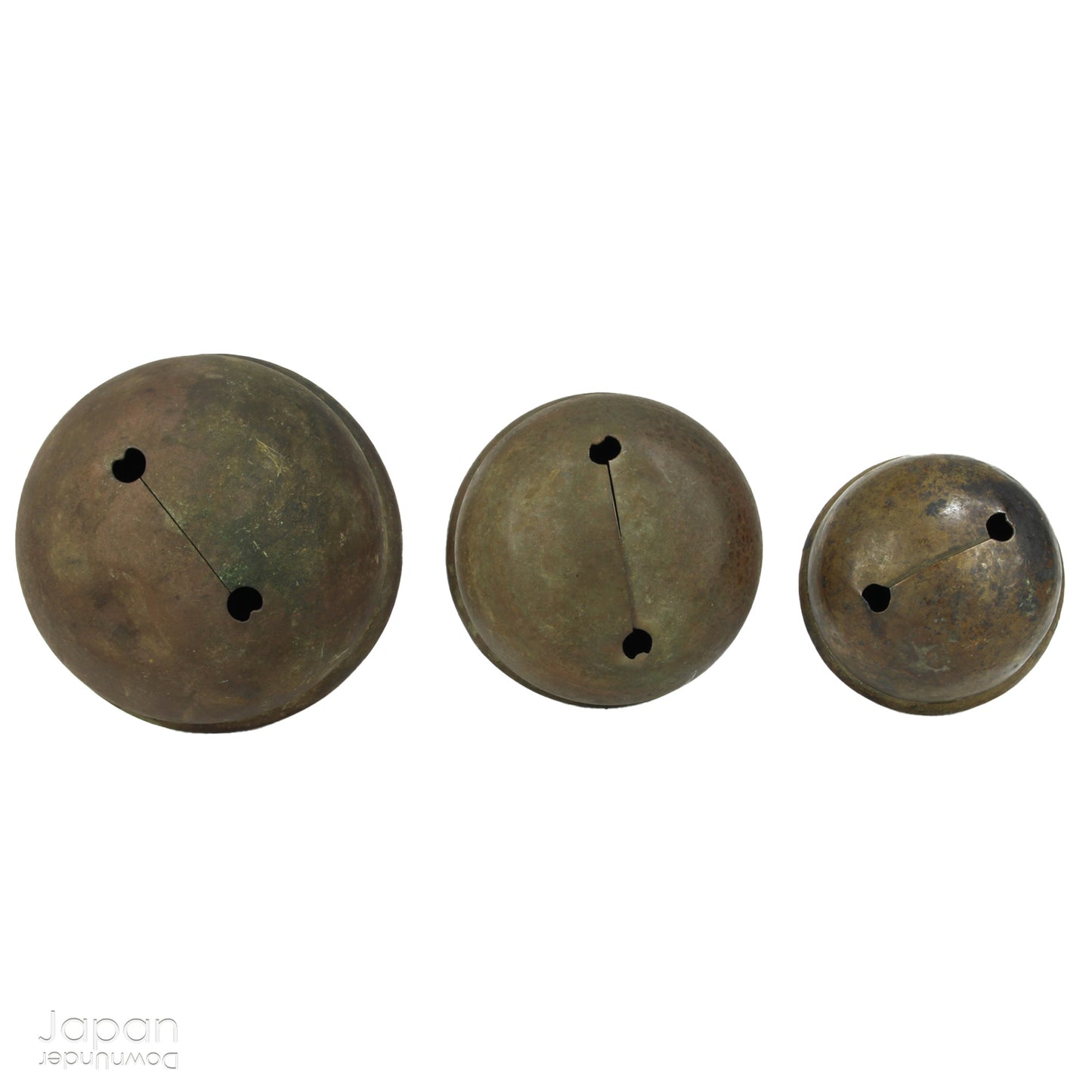 Bring a touch of timeless tradition into your home with this exquisite set of three antique Shinto bronze bell lucky charms, or omamori. Each bell boasts a beautiful, rich patina that speaks of its age and history, adding a unique, vintage charm to any space. These bells aren't just decorative; they are imbued with centuries of spiritual significance, believed to offer blessings, protection, and good fortune to those who possess them.