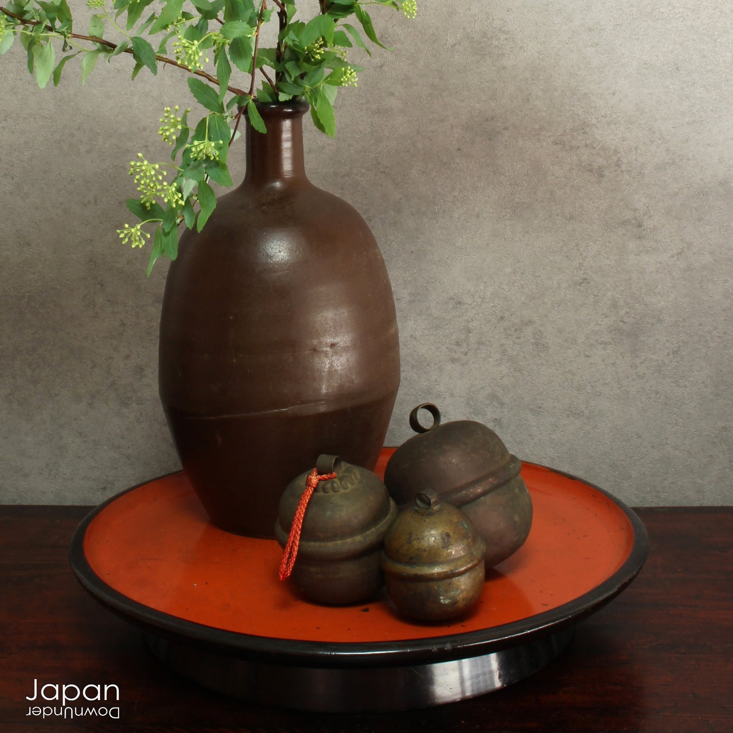 Bring a touch of timeless tradition into your home with this exquisite set of three antique Shinto bronze bell lucky charms, or omamori. Each bell boasts a beautiful, rich patina that speaks of its age and history, adding a unique, vintage charm to any space. These bells aren't just decorative; they are imbued with centuries of spiritual significance, believed to offer blessings, protection, and good fortune to those who possess them.