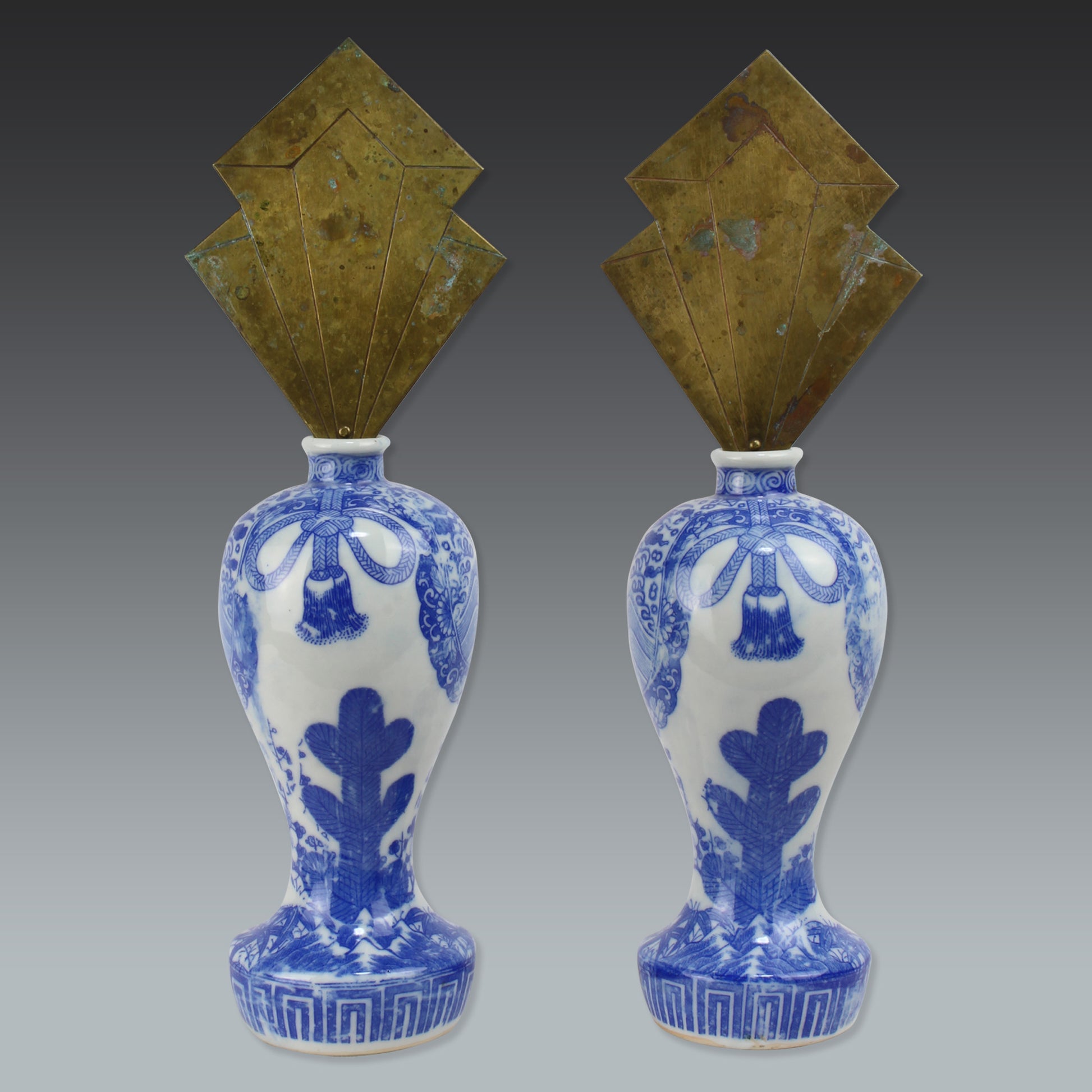 Enhance your sacred space with this wonderful pair of antique brass flames in old imari sake bottles, made to be offered at Shinto altars. Believed to attract prosperity and ward off evil, these unique pieces will bring a touch of tradition.