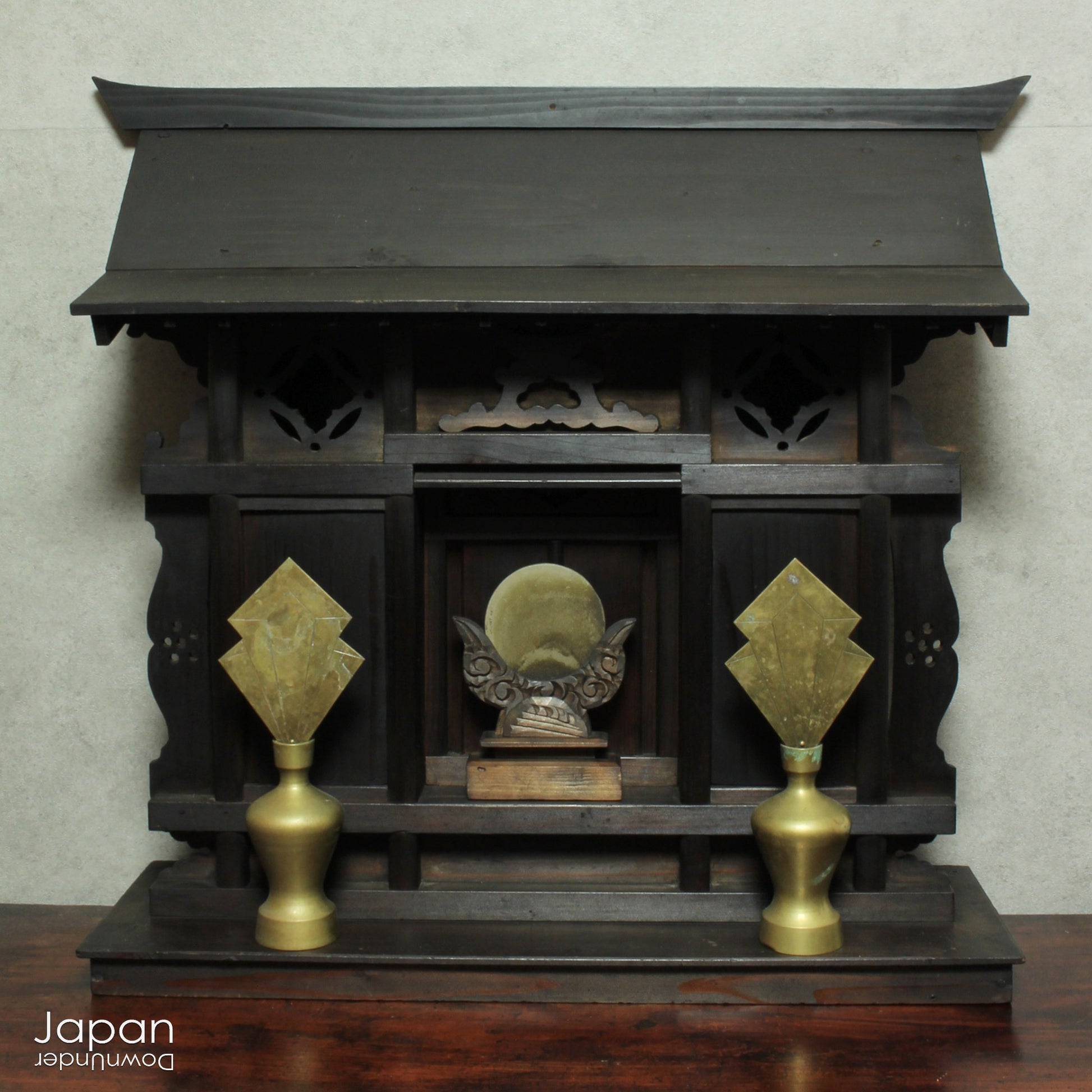 A wonderful antique folk art Japanese kamidana shrine that exudes a beautiful rustic charm, sure to add a touch of serenity to your living space. Crafted with intricate details and a timeless aesthetic.