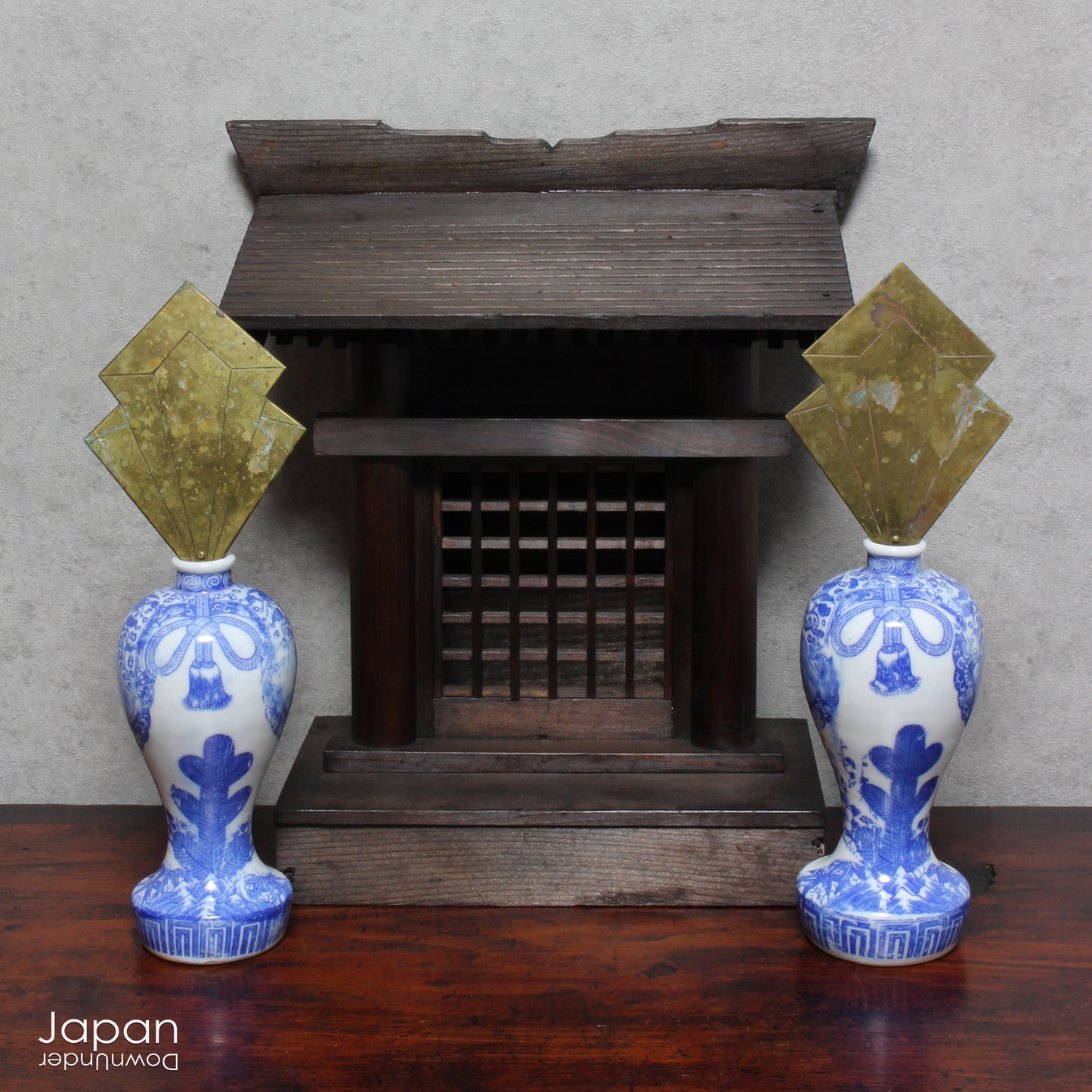 Enhance your sacred space with this wonderful pair of antique brass flames in old imari sake bottles, made to be offered at Shinto altars. Believed to attract prosperity and ward off evil, these unique pieces will bring a touch of tradition.