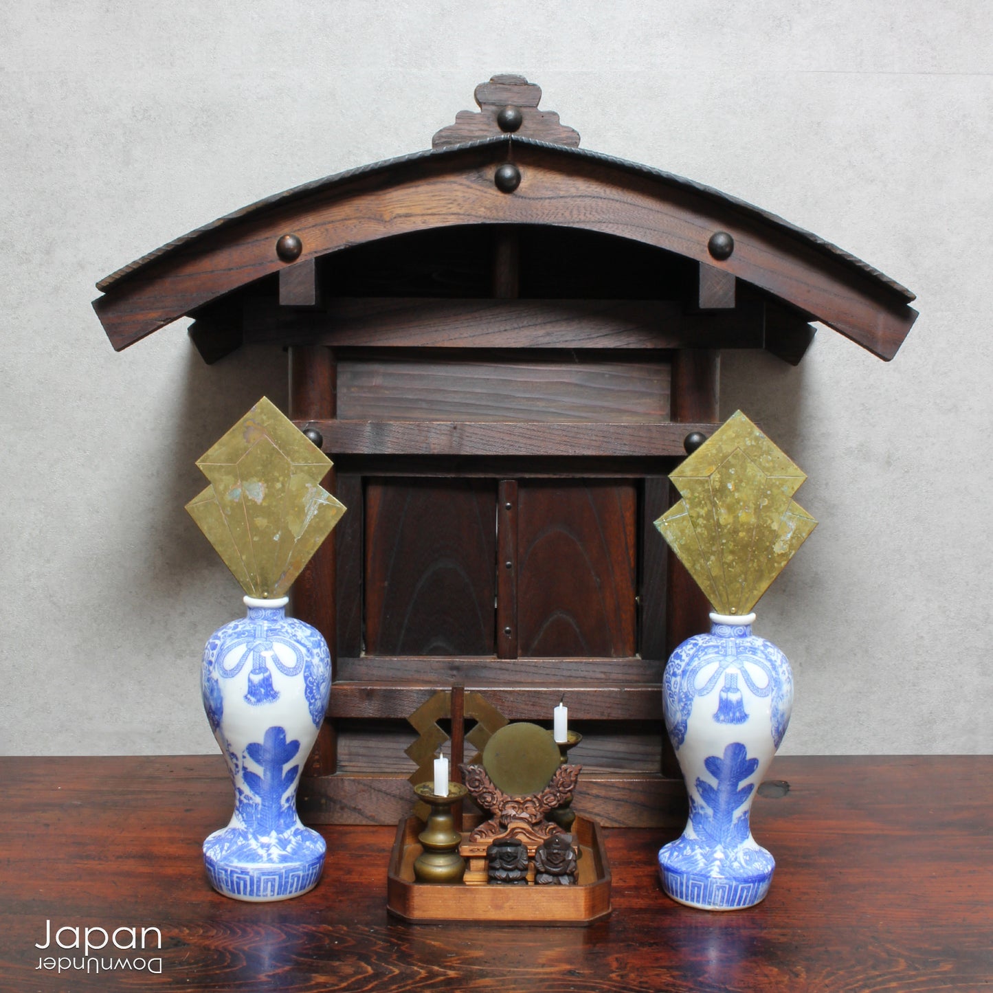 Enhance your sacred space with this wonderful pair of antique brass flames in old imari sake bottles, made to be offered at Shinto altars. Believed to attract prosperity and ward off evil, these unique pieces will bring a touch of tradition.