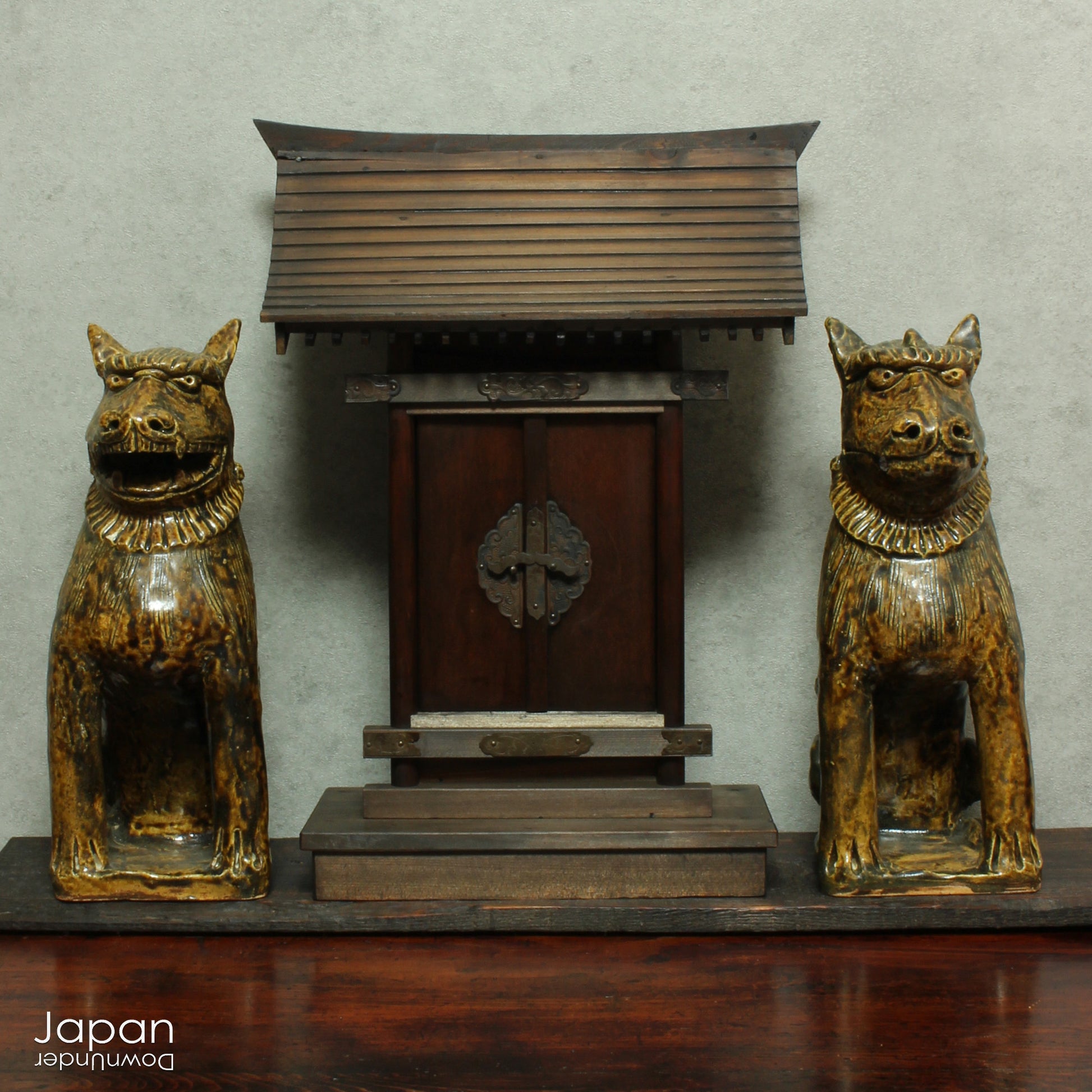 Bring an air of mystique and protection to your home with this stunning pair of antique stoneware lion dogs, known as Komainu. Revered in Japanese culture for centuries, these guardians are traditionally stationed at the entrances of Shinto shrines to ward off evil spirits and bring a sense of peace. With their captivating design and spiritual significance, they are sure to add a unique touch to your decor while embracing the ancient traditions of protection.