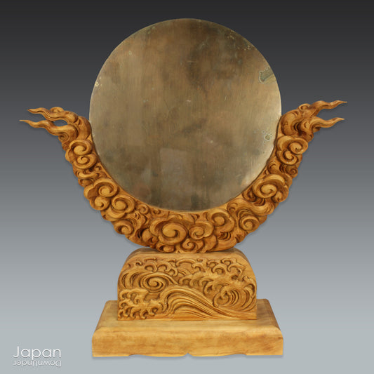 Enhance your spiritual space with this majestic rare antique Shinto shrine mirror. Resting on an intricately carved stand, this piece is a unique and beautiful addition to any sacred setting. Invite tranquility and elegance into your home with this spiritual space enhancer.