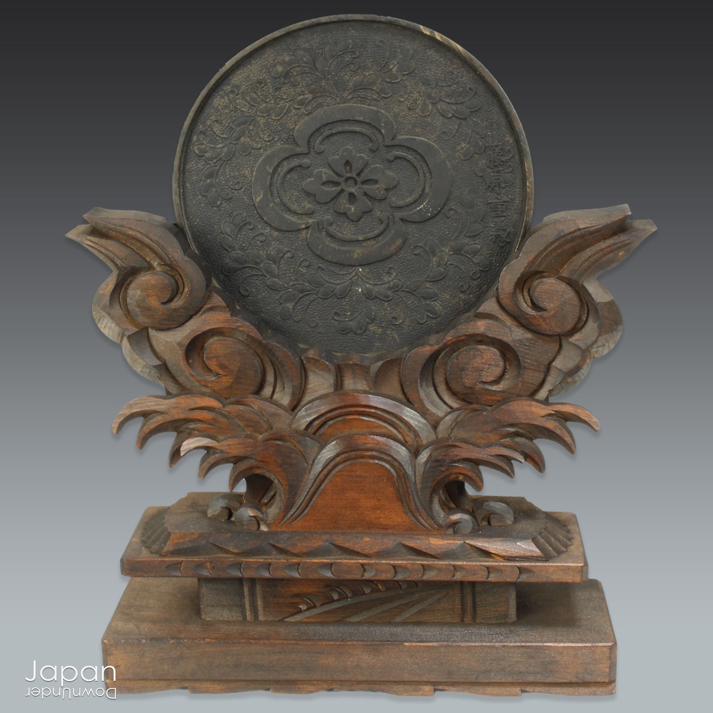 Infuse your home with serenity and spiritual elegance with this wonderful Shinto shrine mirror. Set upon an intricately carved wooden stand, this stunning piece is more than just a decor item—it’s a meaningful addition to any space that seeks harmony and balance.