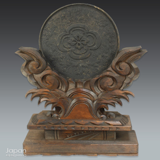 Infuse your home with serenity and spiritual elegance with this wonderful Shinto shrine mirror. Set upon an intricately carved wooden stand, this stunning piece is more than just a decor item—it’s a meaningful addition to any space that seeks harmony and balance.