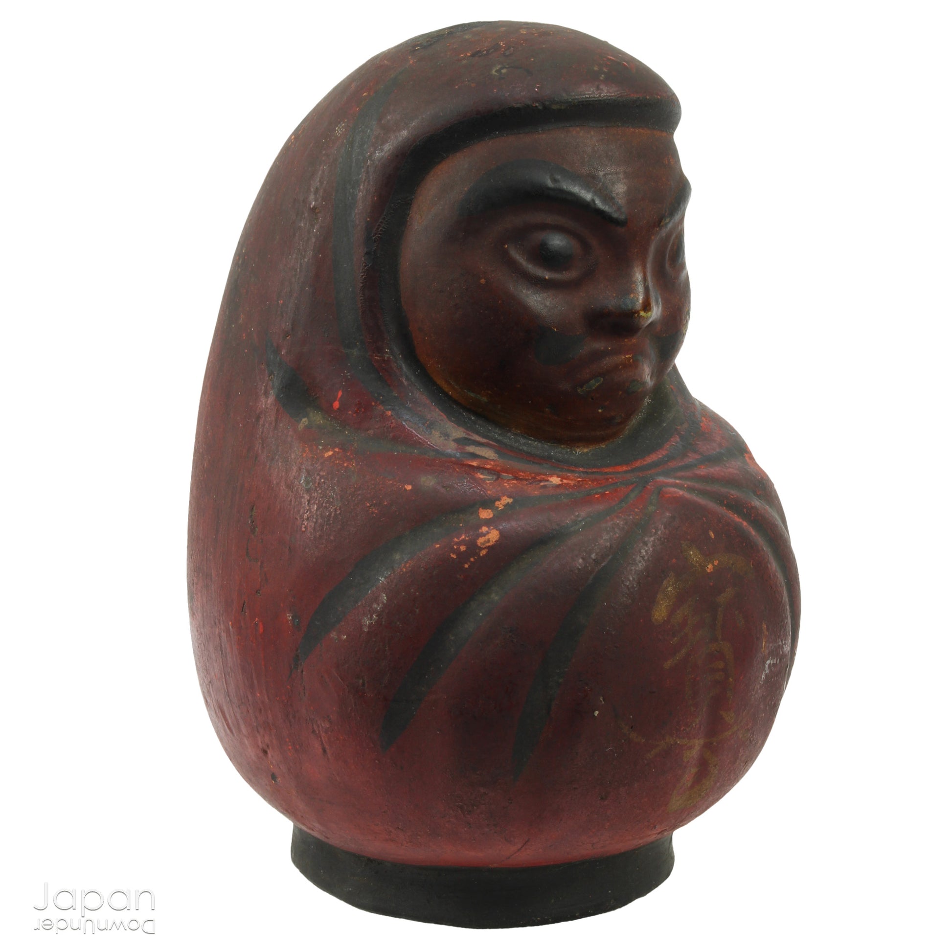 Add a touch of history to your home with this antique Meiji Era Hirashimizu ware lucky Daruma clay doll. Covered in soot it boasts a great darkened rustic patina that adds unique charm to any space. Bring a piece of the past into your modern decor.