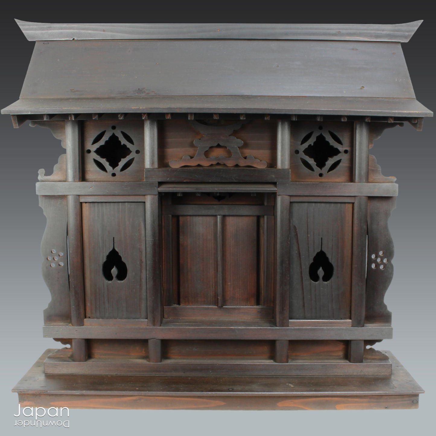 A wonderful antique folk art Japanese kamidana shrine that exudes a beautiful rustic charm, sure to add a touch of serenity to your living space. Crafted with intricate details and a timeless aesthetic.