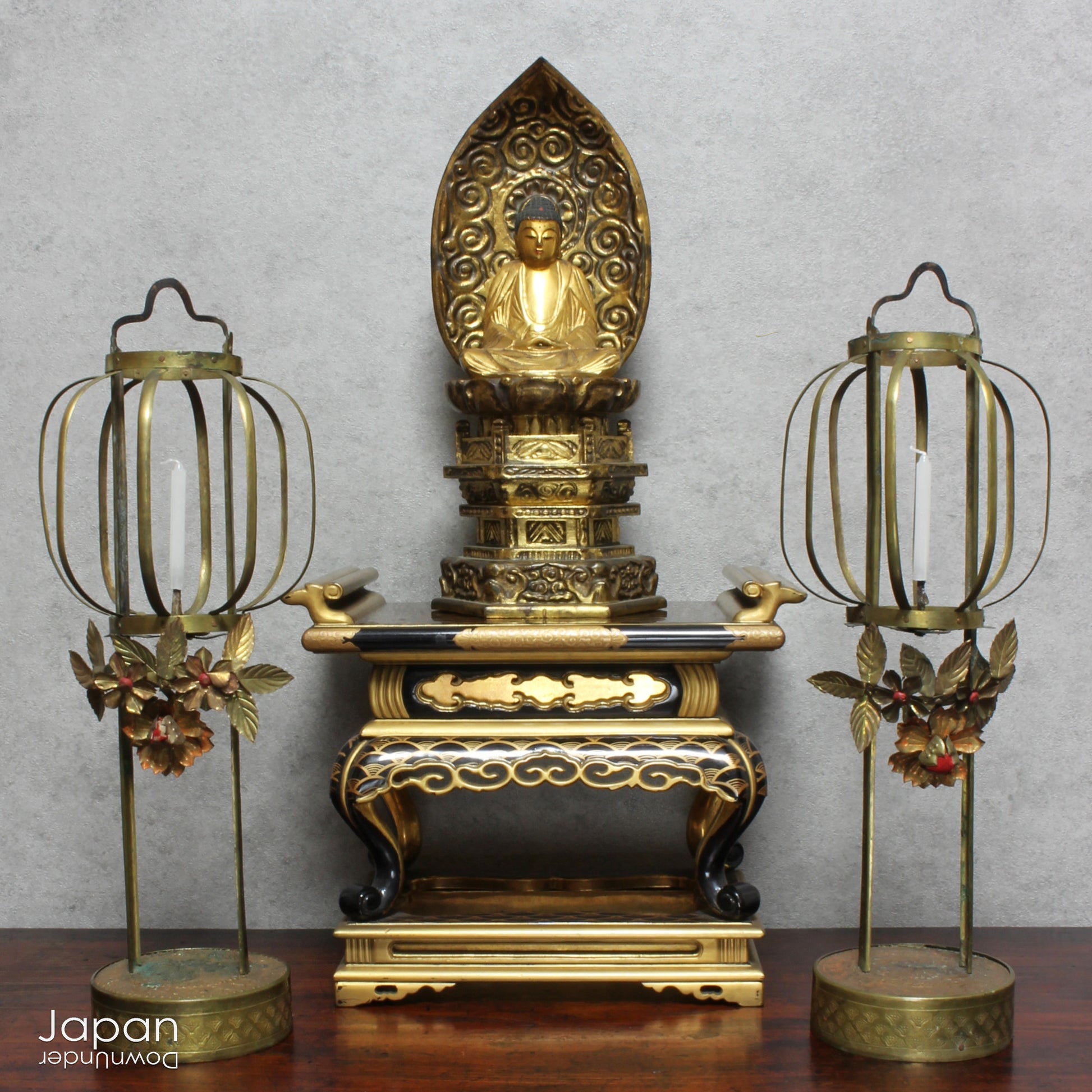 Add a touch of elegance to your space with this exquisite small antique Japanese sutra table. Intricately crafted with black lacquer and gold makie detailing, this table is perfect for displaying your favorite decor and religious items.