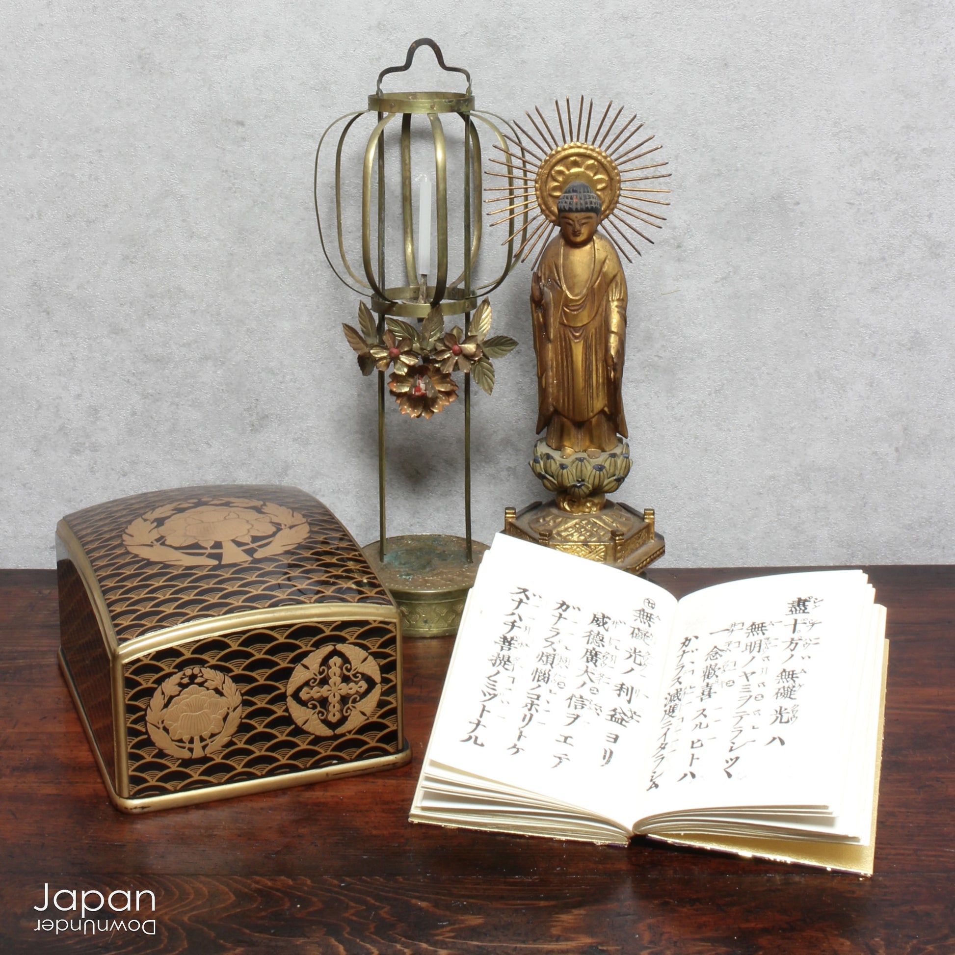 This exquisite antique Japanese sutra box showcases three handwritten volumes of the sacred teachings of Buddha. A blend of history and spirituality, this unique piece is perfect for collectors or anyone drawn to the wisdom of the East.