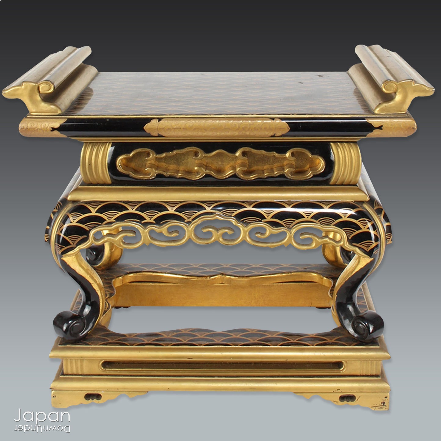 Add a touch of elegance to your space with this exquisite small antique Japanese sutra table. Intricately crafted with black lacquer and gold makie detailing, this table is perfect for displaying your favorite decor and religious items.