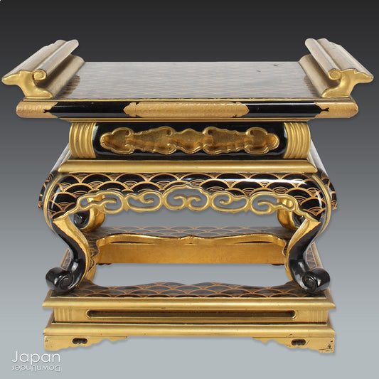 Add a touch of elegance to your space with this exquisite small antique Japanese sutra table. Intricately crafted with black lacquer and gold makie detailing, this table is perfect for displaying your favorite decor and religious items.