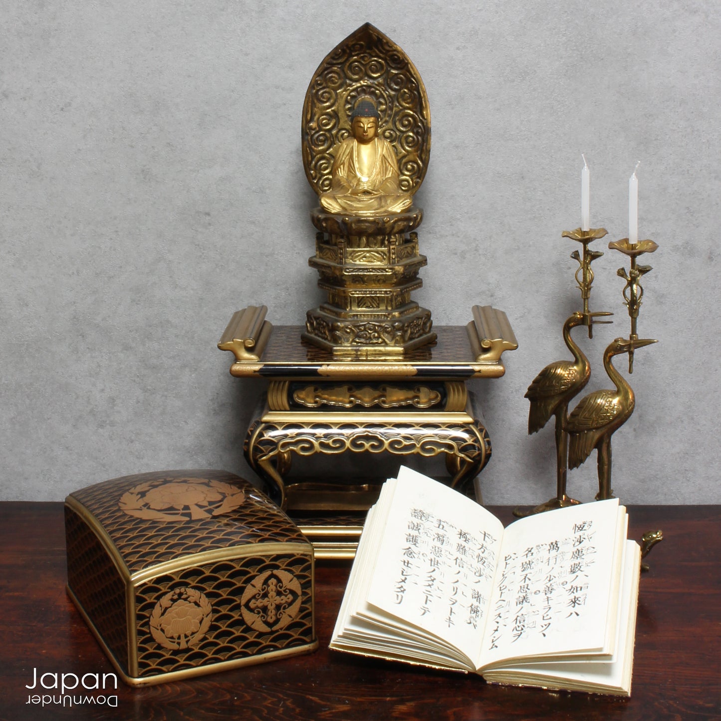 Add a touch of elegance to your space with this exquisite small antique Japanese sutra table. Intricately crafted with black lacquer and gold makie detailing, this table is perfect for displaying your favorite decor and religious items.