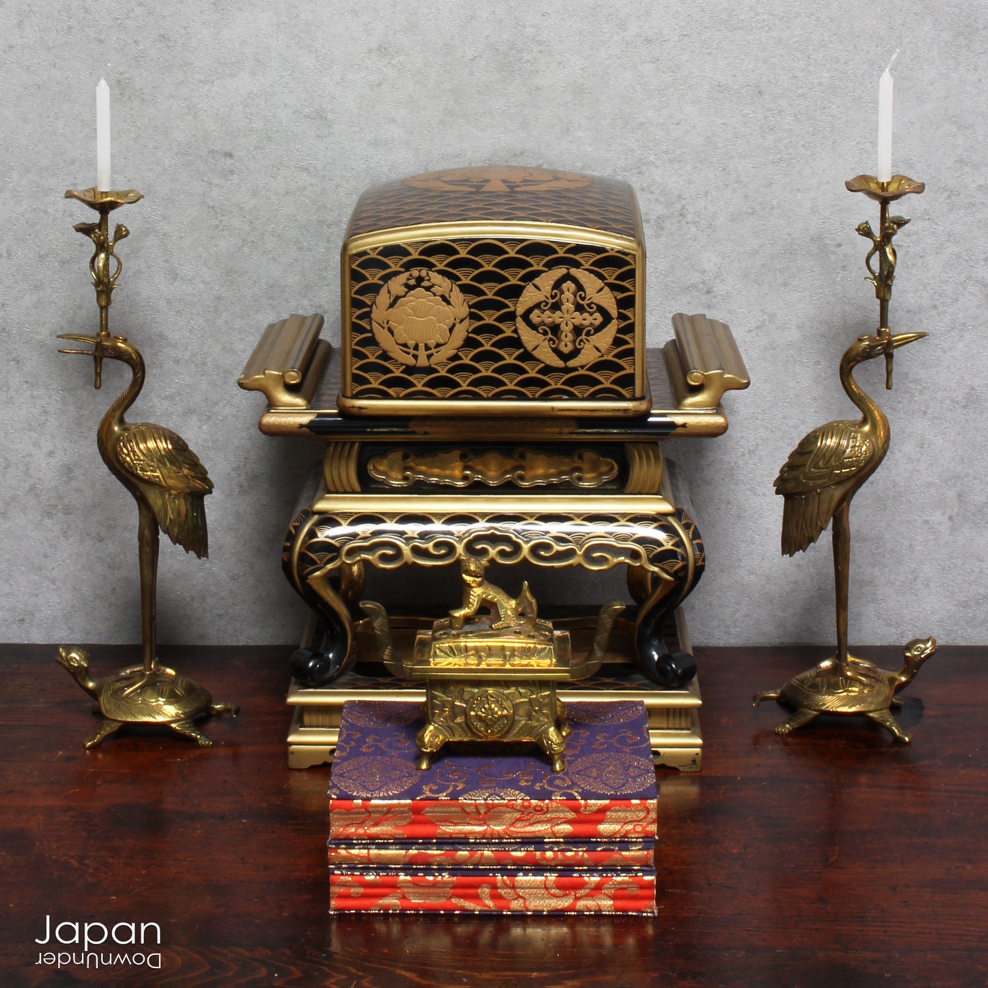 Add a touch of elegance to your space with this exquisite small antique Japanese sutra table. Intricately crafted with black lacquer and gold makie detailing, this table is perfect for displaying your favorite decor and religious items.